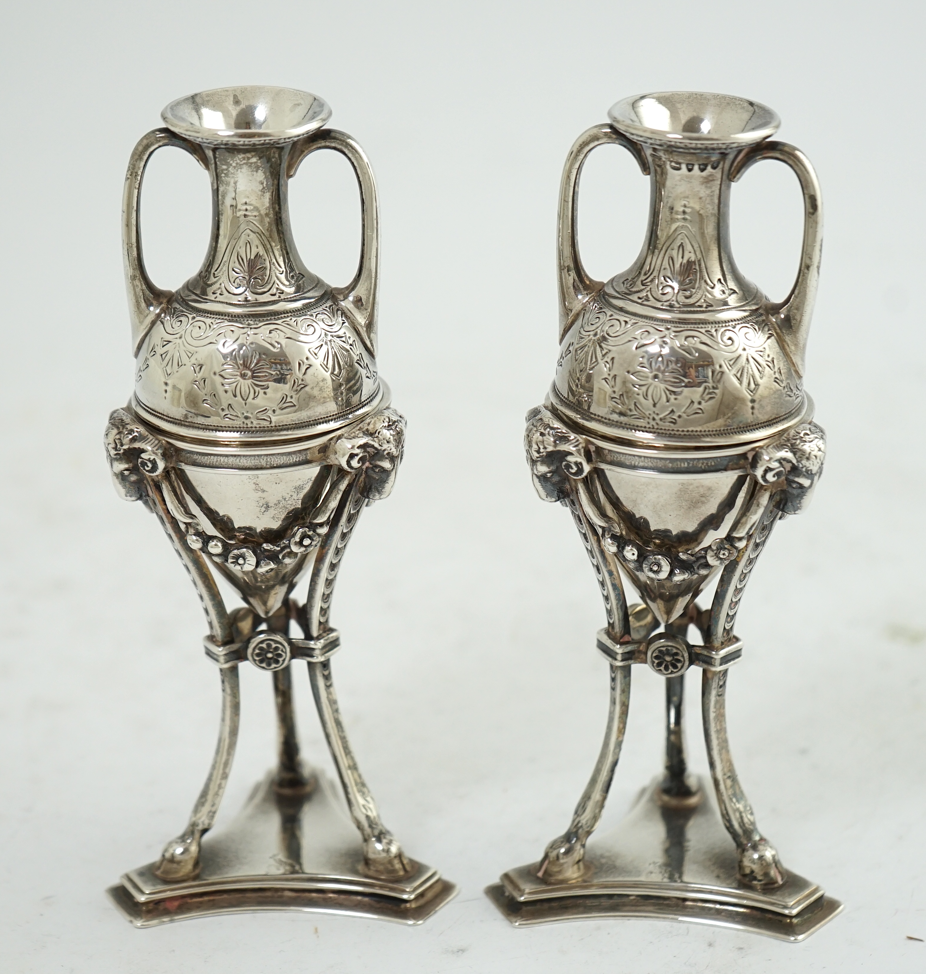 A pair of Victorian silver miniature urns on stands, by William & John Barnard